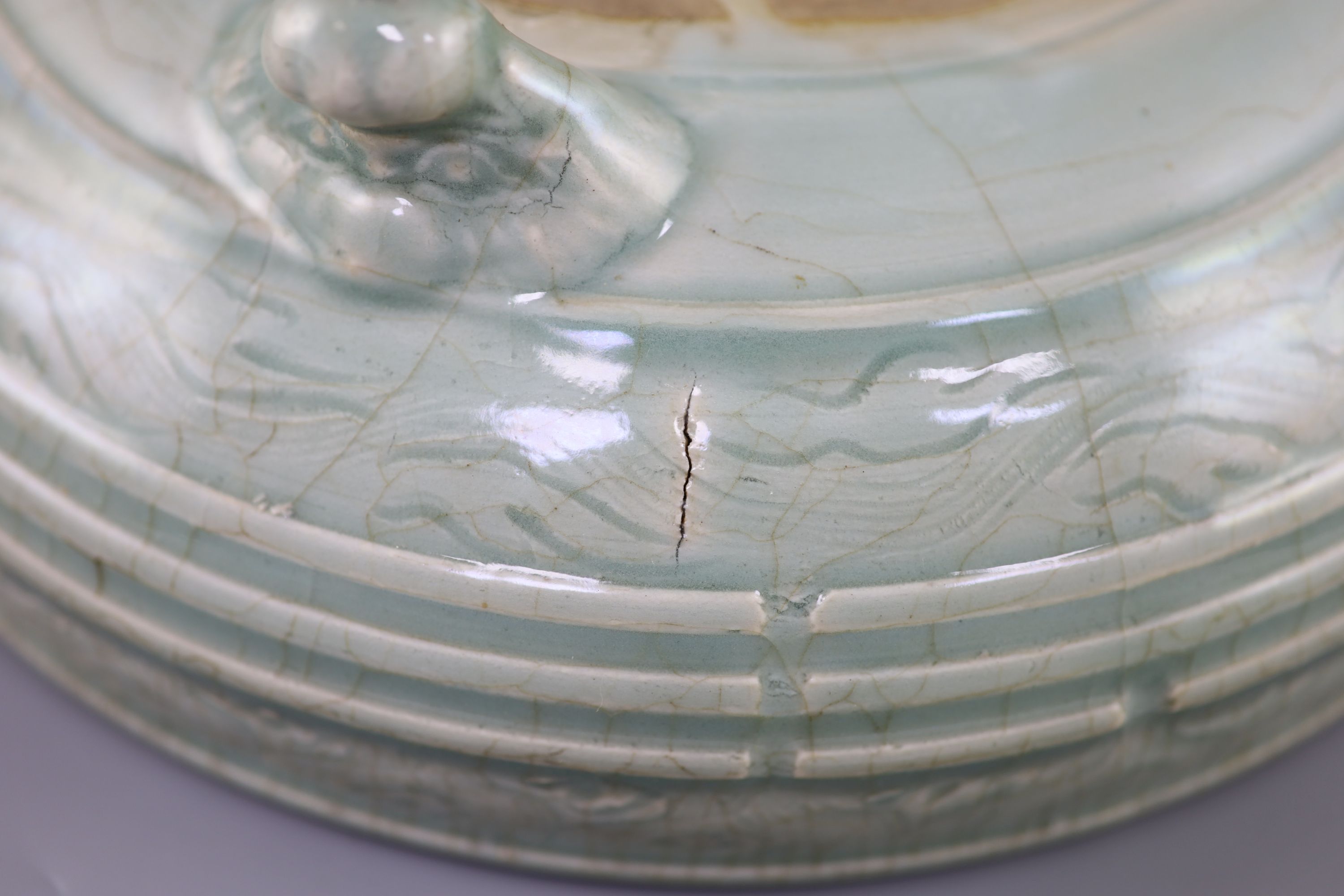 A large Chinese Longquan celadon tripod censer, Ming dynasty, 15th century, 31cm diameter